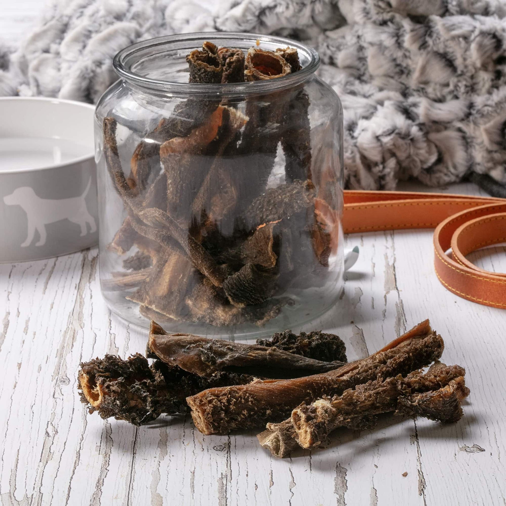 Hollings Tripe Sticks in a glass jar on a table