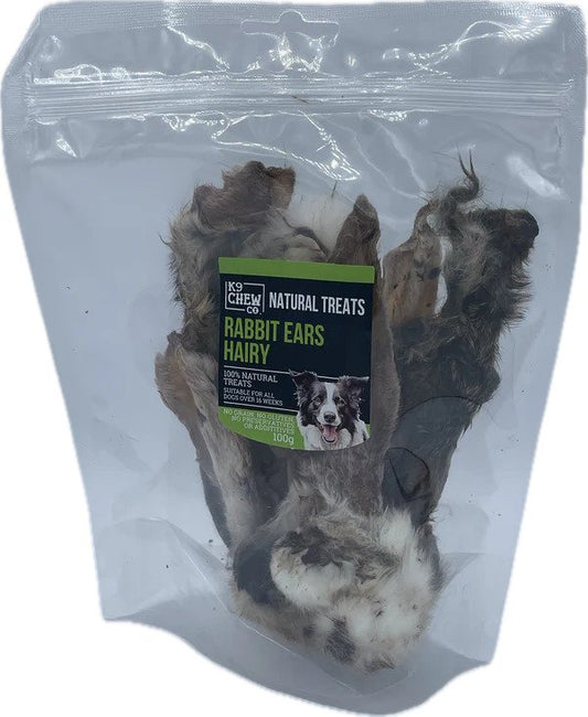 Package of natural dog treats labeled 'Rabbit Ears Hairy' with a visible brand logo.