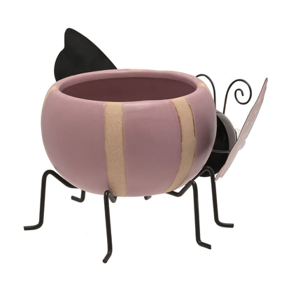 Pink butterfly-shaped planter with a black metal stand on a white background