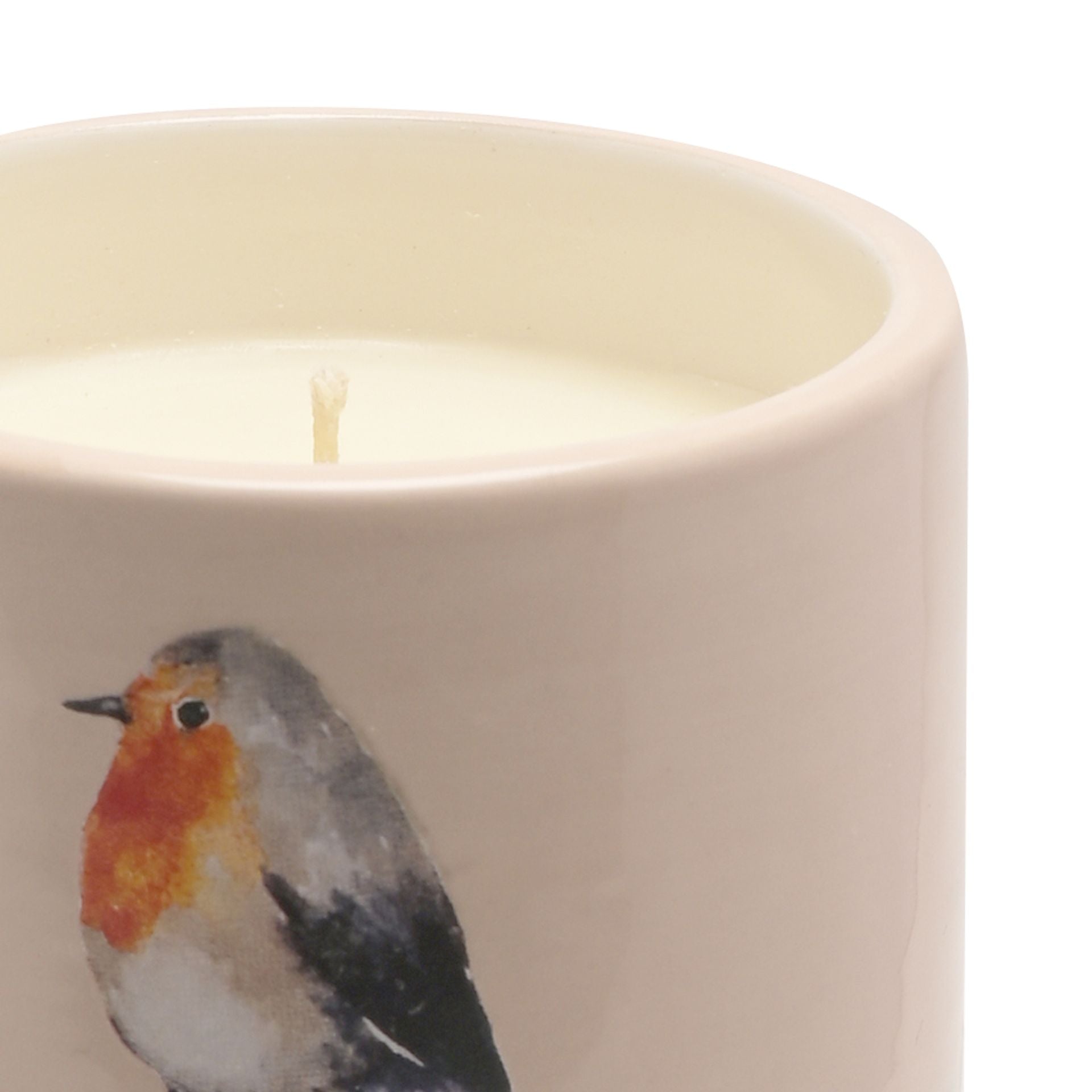 Candle in a container with a robin design on a white background