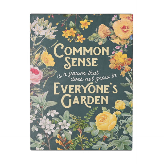 Book cover with floral design and text 'Common Sense is a flower that does not grow in Everyone's Garden' on a dark green background.
