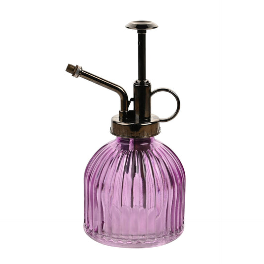 Purple glass spray bottle with black metal nozzle on a white background