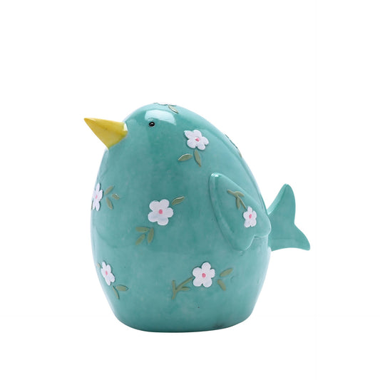 Teal ceramic bird figurine with floral patterns on a white background
