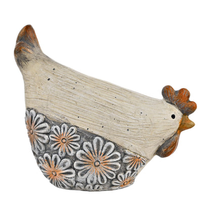 Decorative ceramic chicken with floral patterns on a white background