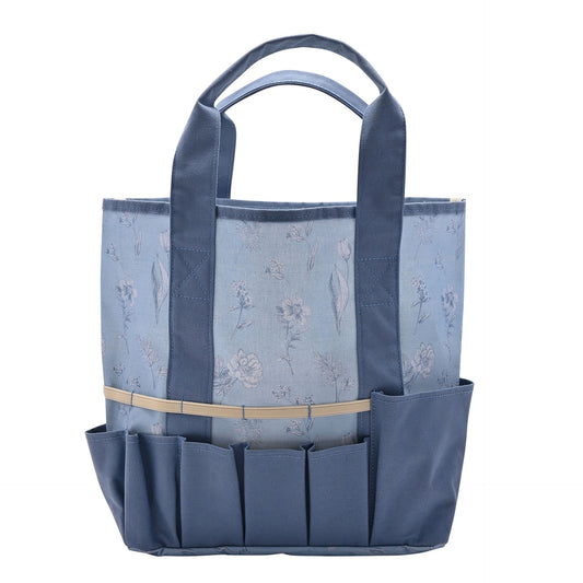 Blue tote bag with floral pattern and multiple pockets on a white background