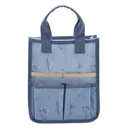 Blue tote bag with floral pattern and a pocket on a white background
