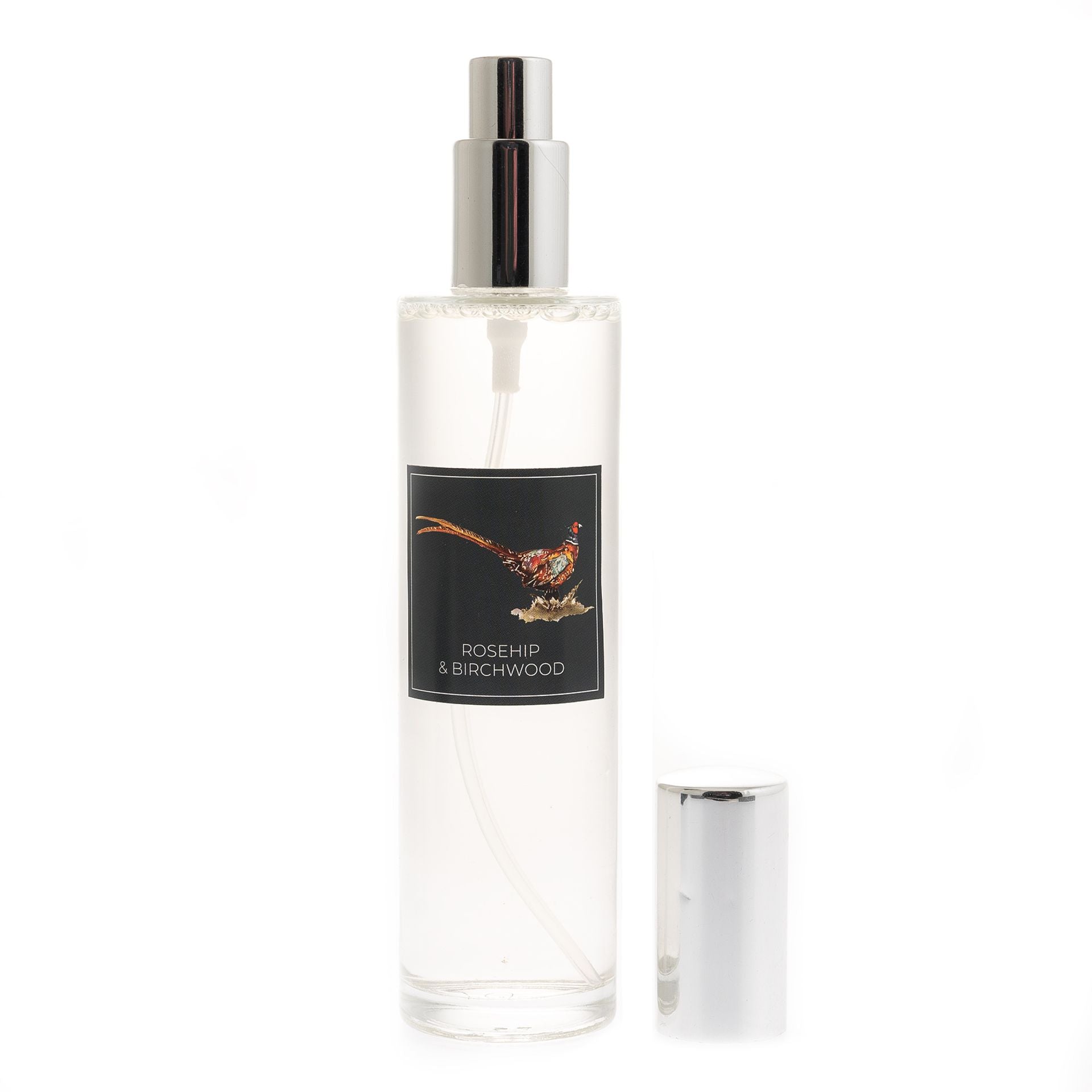 Clear spray bottle labeled 'Rosehip & Birchwood' on a white background