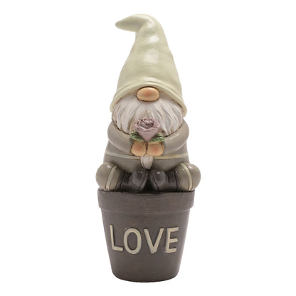 Gnome figurine in a pot with 'LOVE' on a white background
