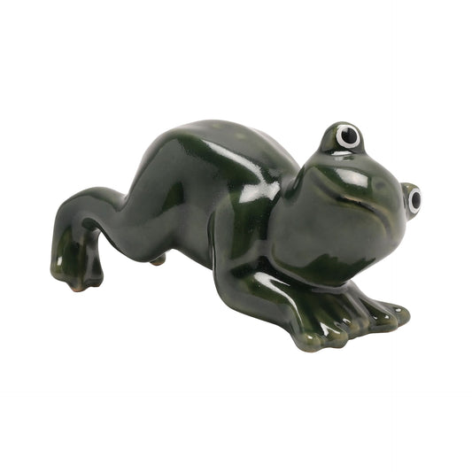 Green ceramic frog figurine on a white background