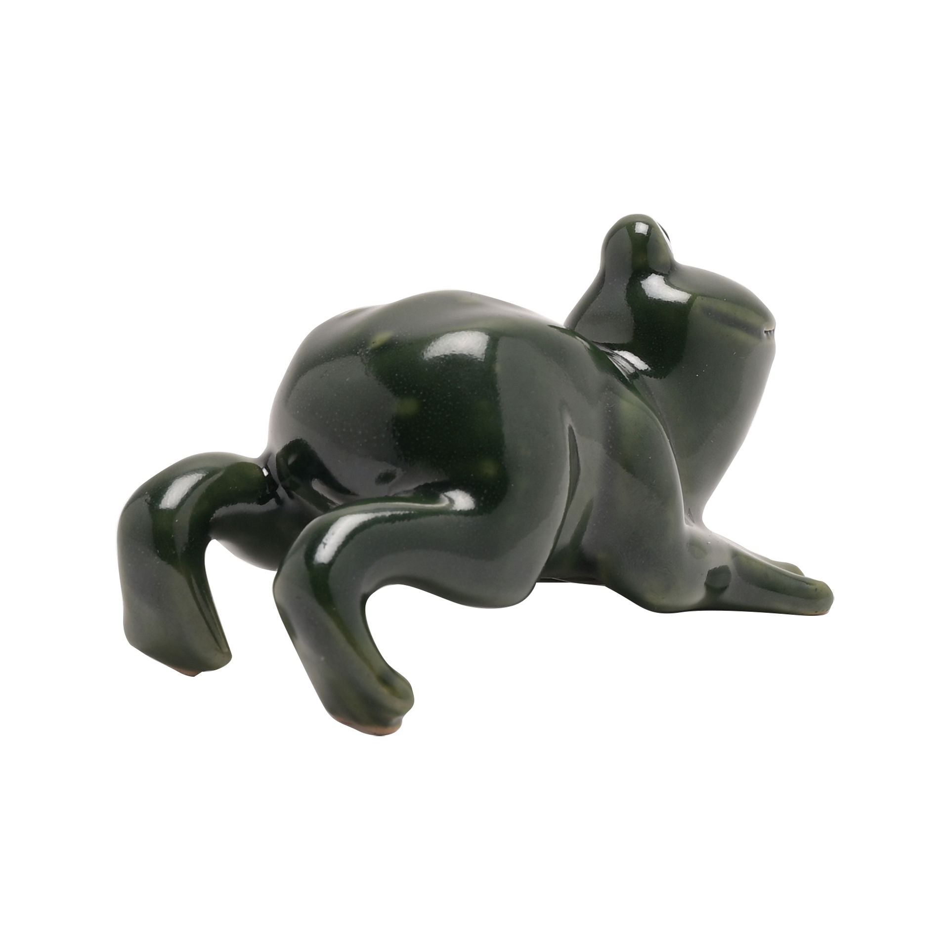 Green ceramic frog figurine on a white background