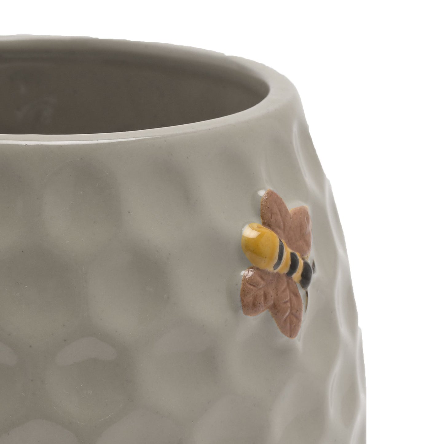 Ceramic planter with honeycomb design and bee decoration on a white background