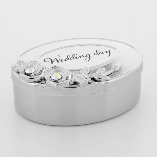 Silver ring box with floral design and 'Wedding day' engraving on a white background