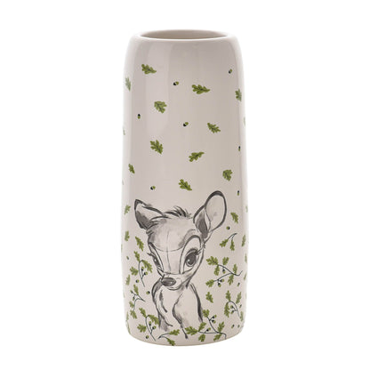 Ceramic vase with a deer illustration and green leaf pattern on a white background