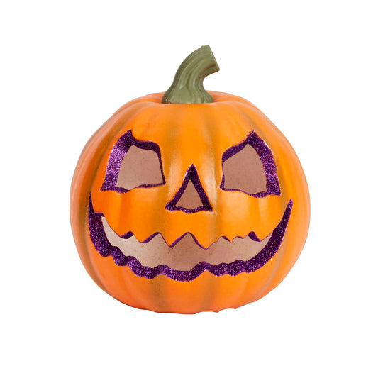 An orange jack-o'-lantern pumpkin with a green stem, featuring purple glittery cutout details for the eyes, nose, and mouth, shown on a plain white background.