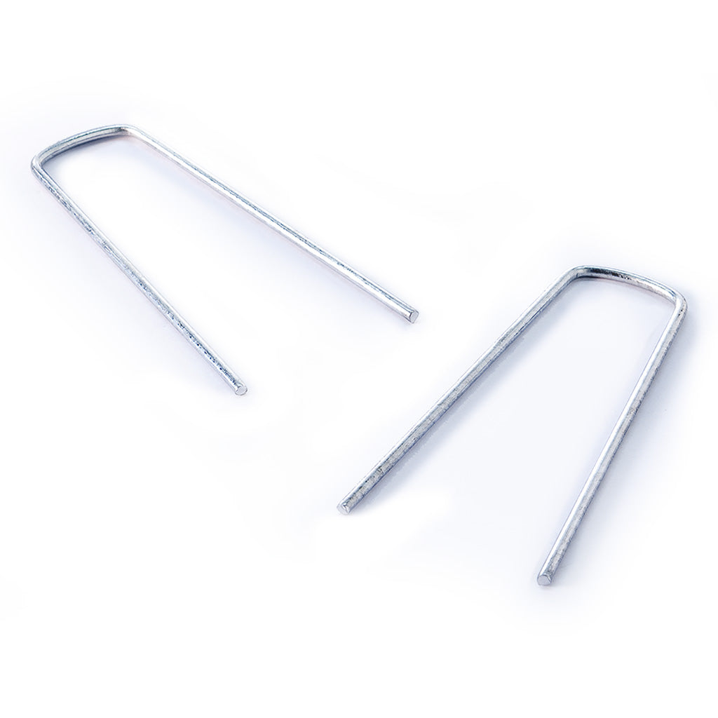 Silver garden staples on a white background