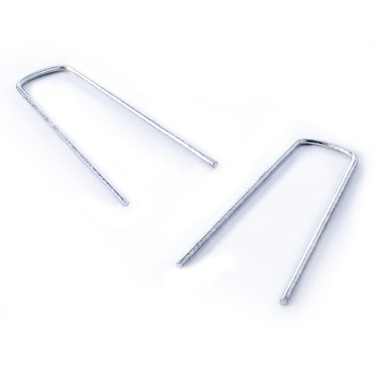 Silver garden staples on a white background