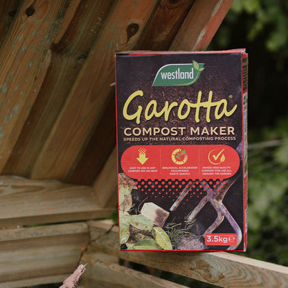 Westland Garotta Compost Maker 3.5KG on top of a wooden compost bin