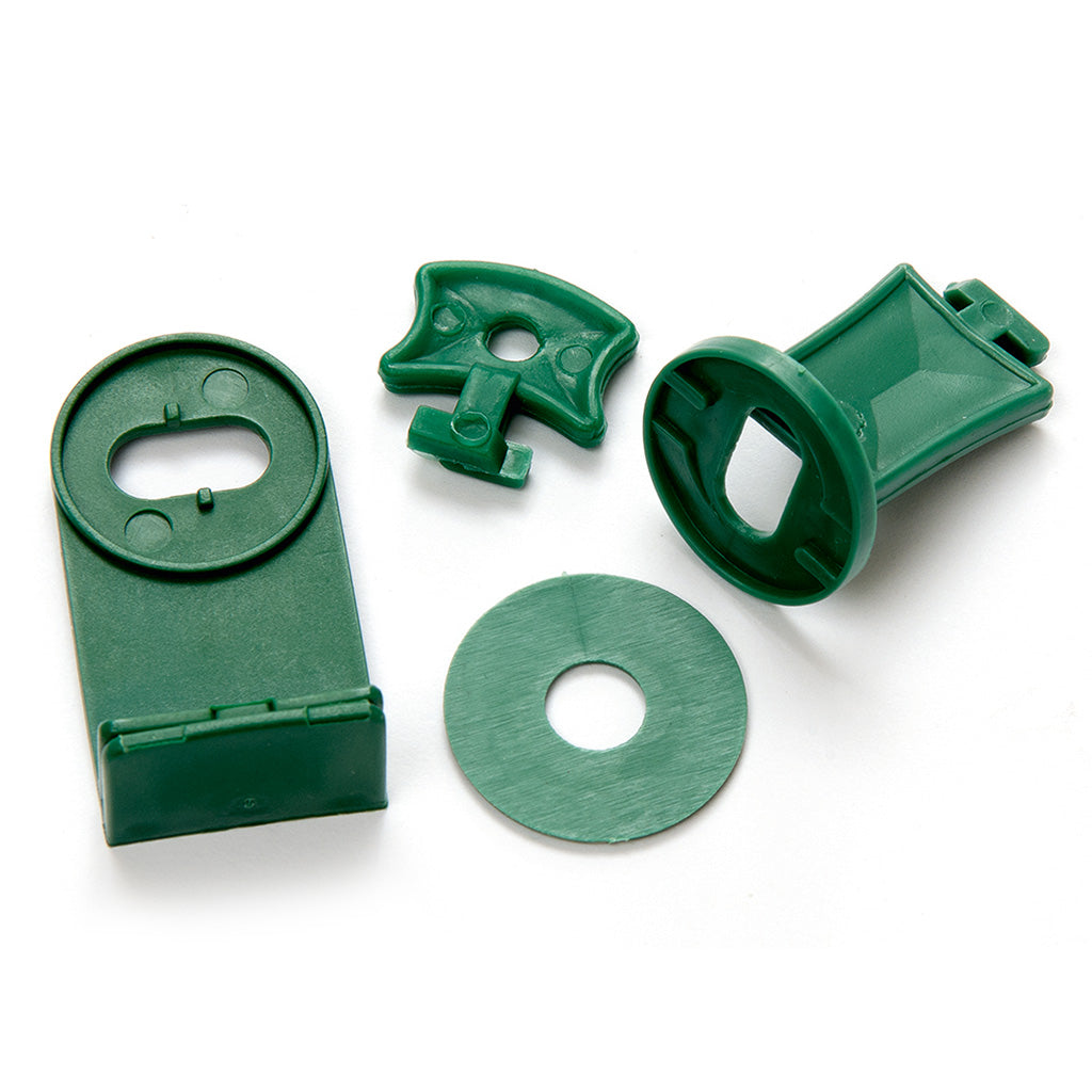 Set of green plastic components on a white background