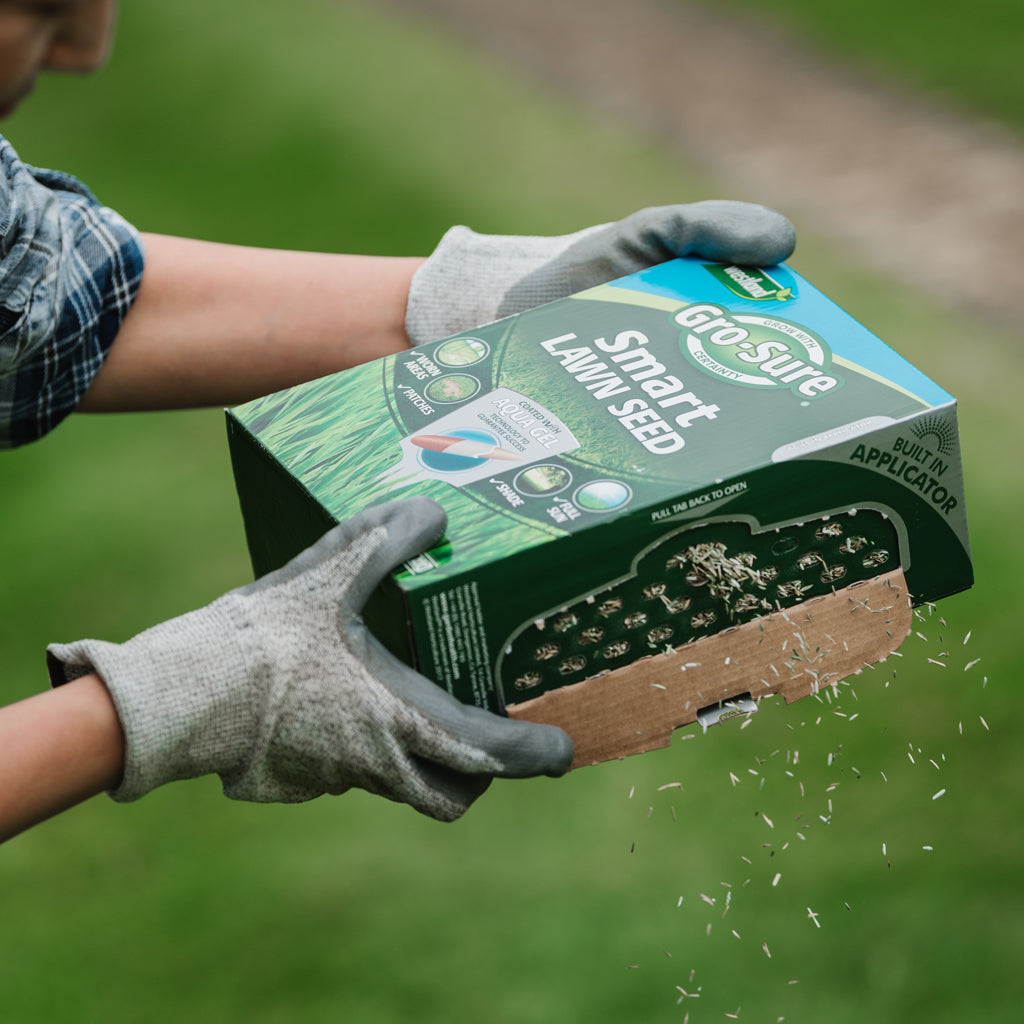 Gro-Sure Smart Seed 25m² being distributed onto grass