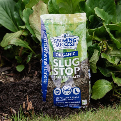 Growing Success Slug Stop Pellet Barrier 2.25KG in a garden