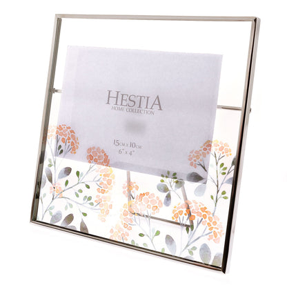 Metal photo frame with floral design and Hestia Home Collection label on a white background