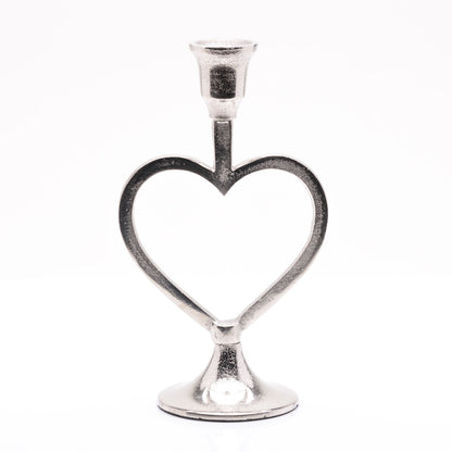 Silver heart-shaped candle holder on a white background