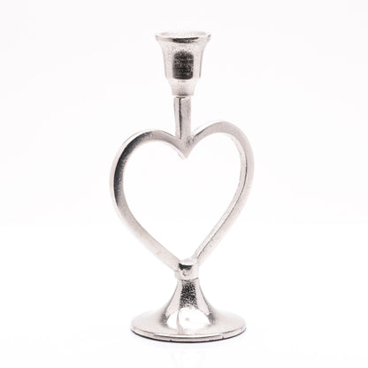 Silver heart-shaped candle holder on a white background