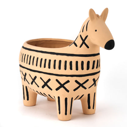Ceramic zebra-shaped planter with black patterns on a white background