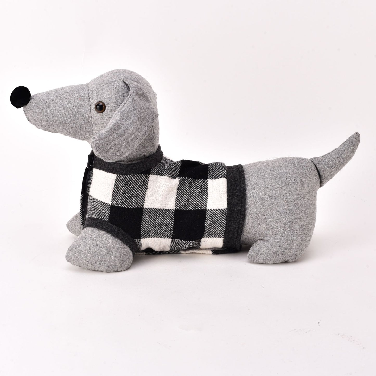 Gray plush dachshund toy wearing a black and white checkered sweater on a white background