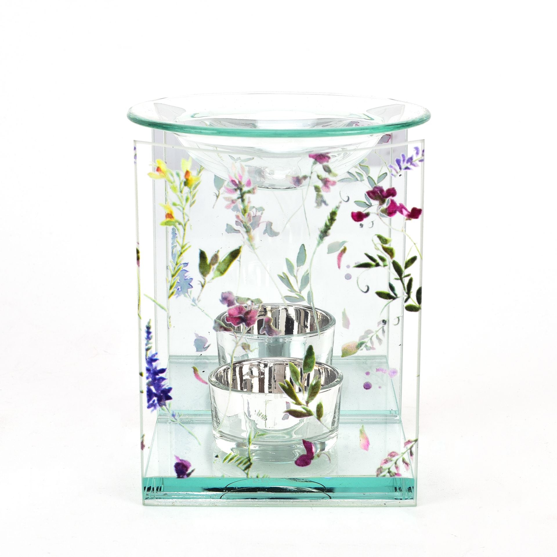 Glass candle holder with floral design on a white background