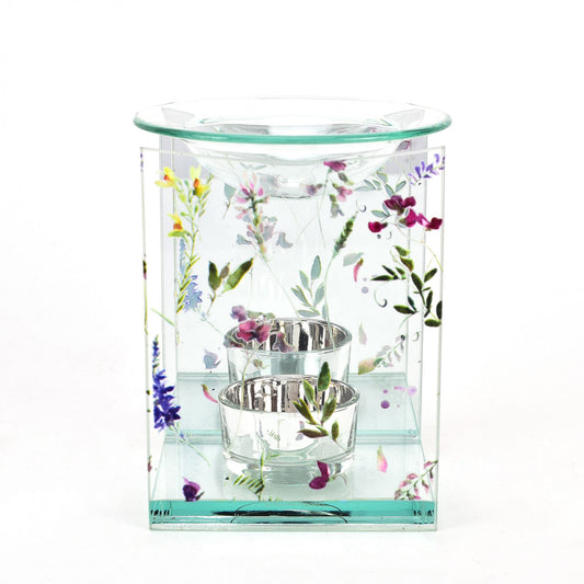 Glass candle holder with floral design on a white background
