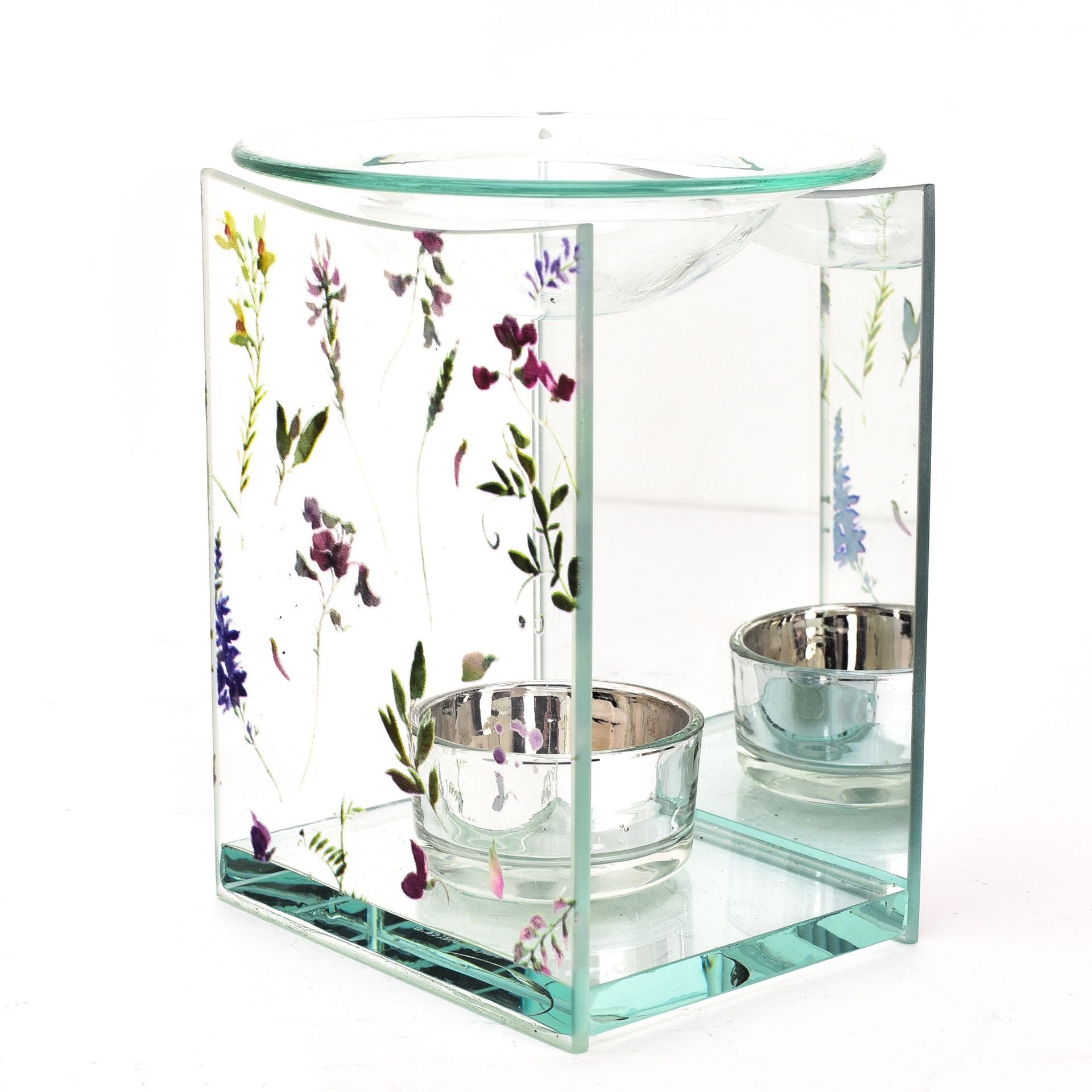 Glass candle holder with floral design on a white background