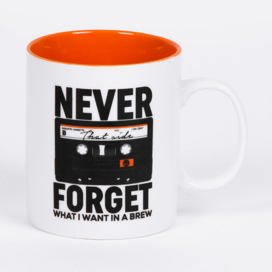 White mug with orange interior, black cassette tape design, and text on a white background