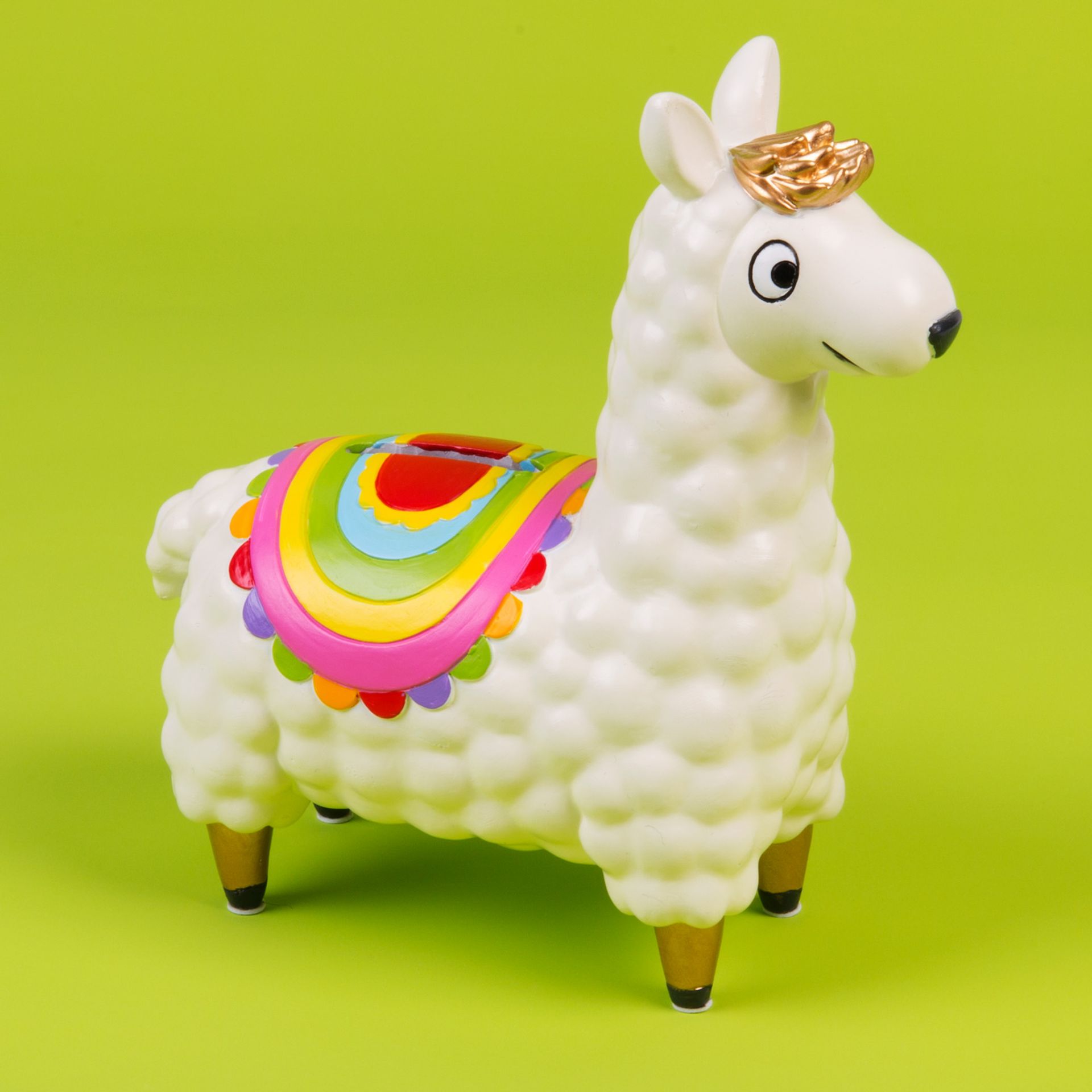 Colorful llama-shaped piggy bank with a rainbow design on a green background