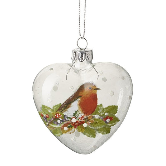 Heart-shaped glass ornament with a robin and holly design on a white background