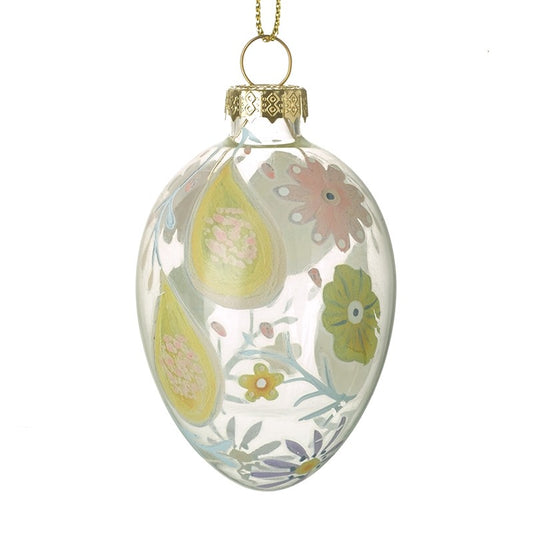 Decorative glass ornament with floral design on a white background