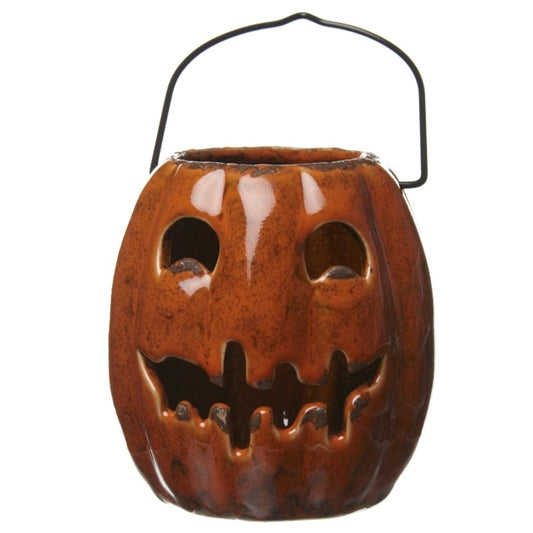Ceramic jack-o'-lantern with a face design on a white background