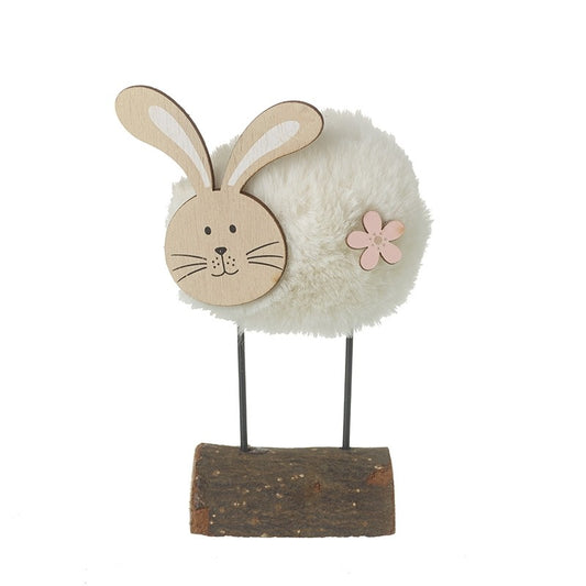 Decorative rabbit figure with white fur, wooden ears, and a pink flower on a white background