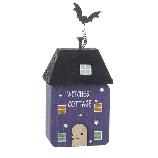 Decorative Halloween house with 'Witches' Cottage' text on a white background