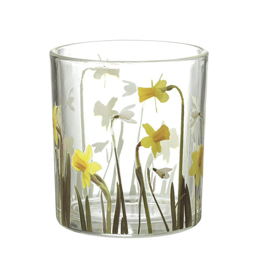 Clear glass candle holder with floral design on a white background