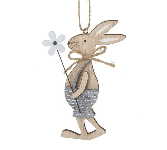 Wooden rabbit ornament holding a white flower on a white background