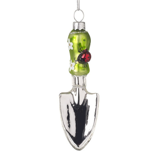 Decorative ornament shaped like a garden trowel with a green handle featuring a ladybug and flowers, on a white background.