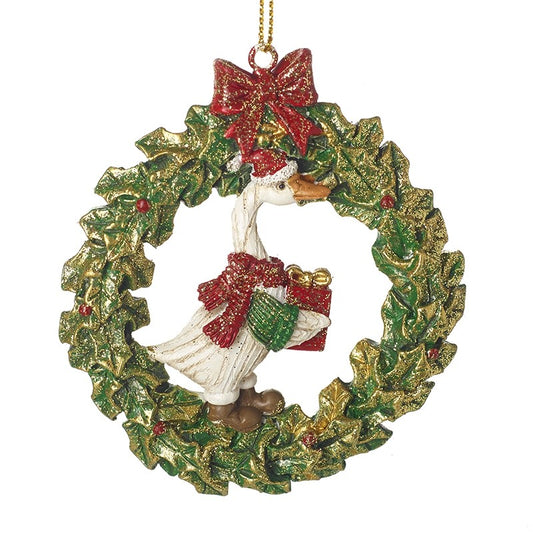 Decorative Christmas ornament with a goose in a wreath, red bow, and gift.