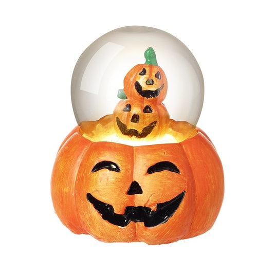 Halloween-themed snowglobe with a jack-o'-lantern design on a white background