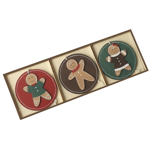 Three gingerbread-themed coasters in a decorative box on a white background