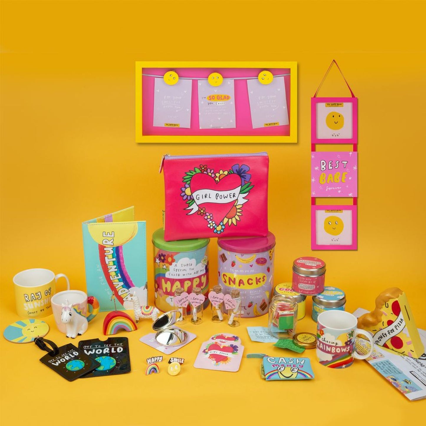 Collection of colorful stationery items and accessories on a yellow background