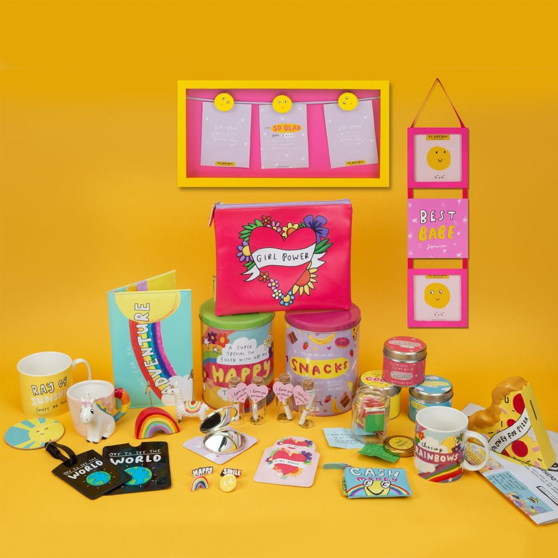 Collection of colorful stationery items and accessories on a yellow background