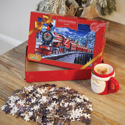 Jigsaw puzzle set with a Santa's Express train box, puzzle pieces, and a mug on a wooden surface.