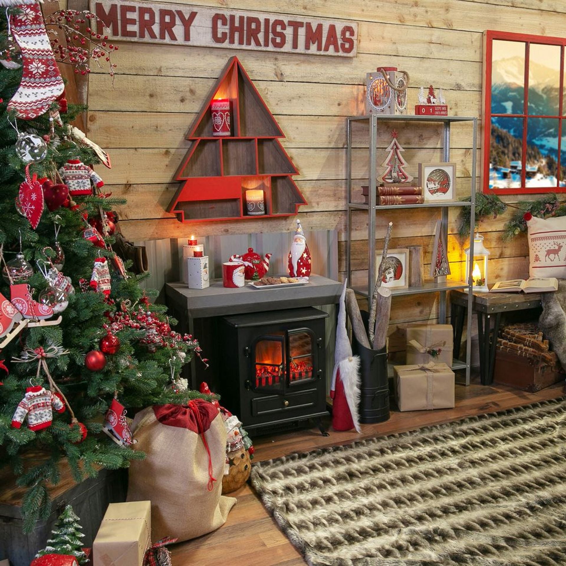 Christmas-themed room with decorated tree, fireplace, and festive decor.