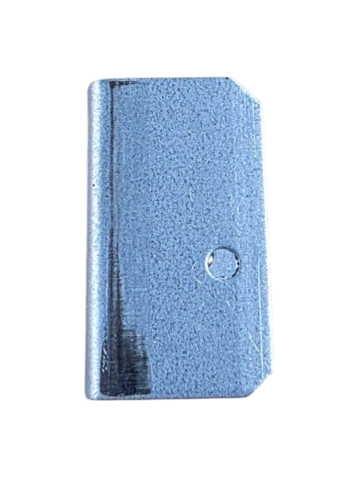 A rectangular metallic blue-gray component with a textured surface, a rounded top-right corner, and a small circular hole near the center, isolated on a white background.